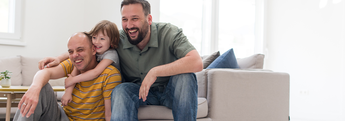 Portrait of Male Gay Couple with Adopted Child
