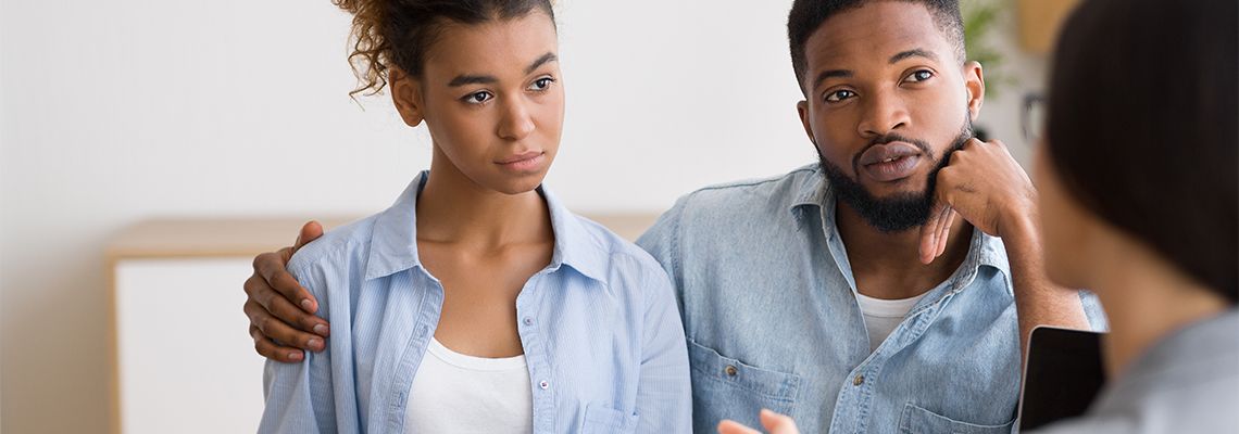 Couples consulting with attorney for estate plan