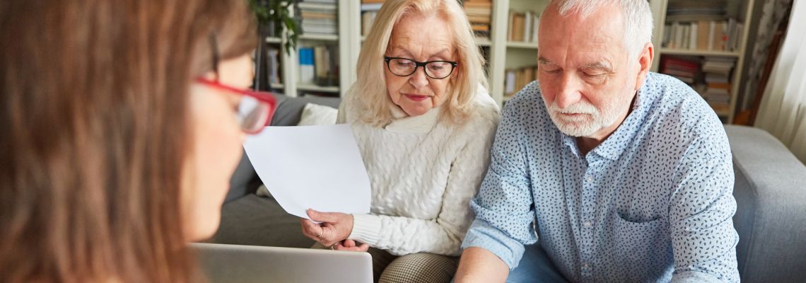 Senior couples signing Advance Directive