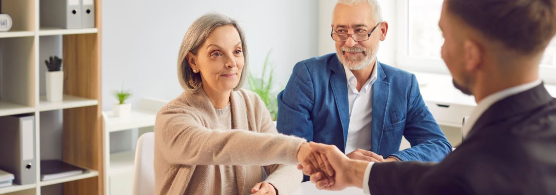 Senior couples consulting with attorney
