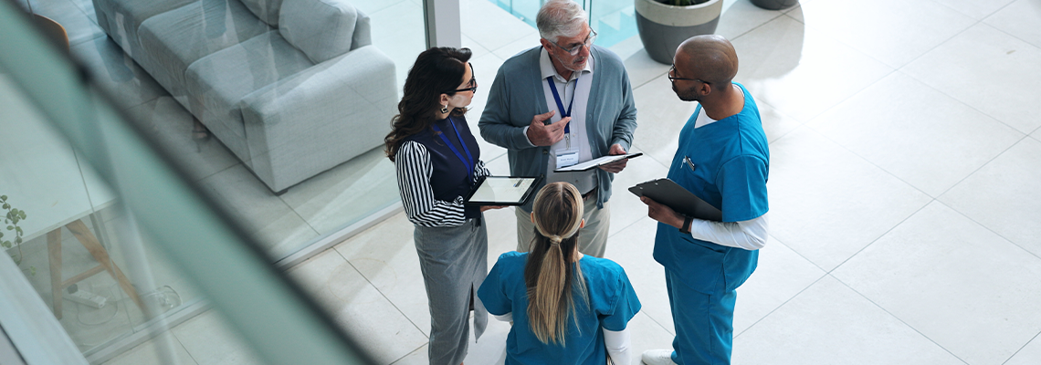 Doctors, medical team and tablet with discussion, advice and above for surgery