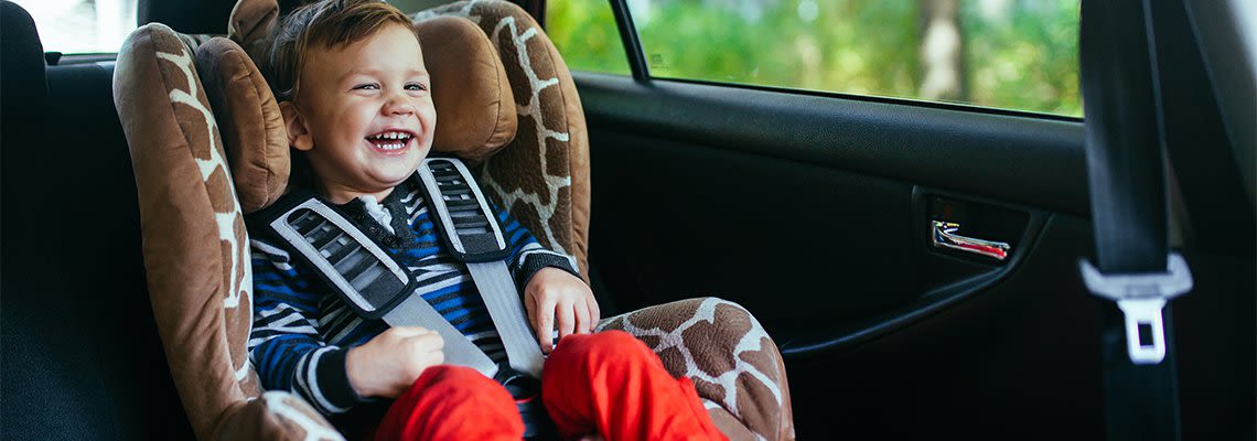 Baby_in_car_seat_smiling.2e16d0ba.fill-1140x400