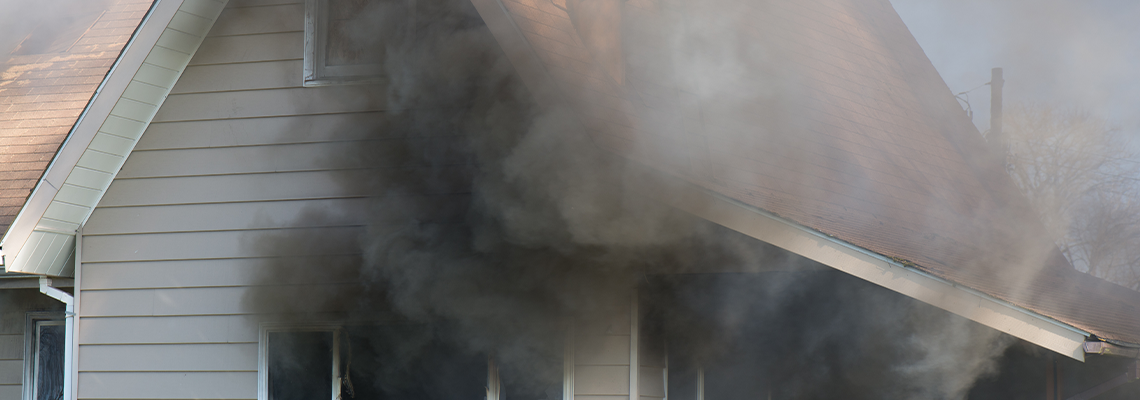 House with smoke coming out of windows