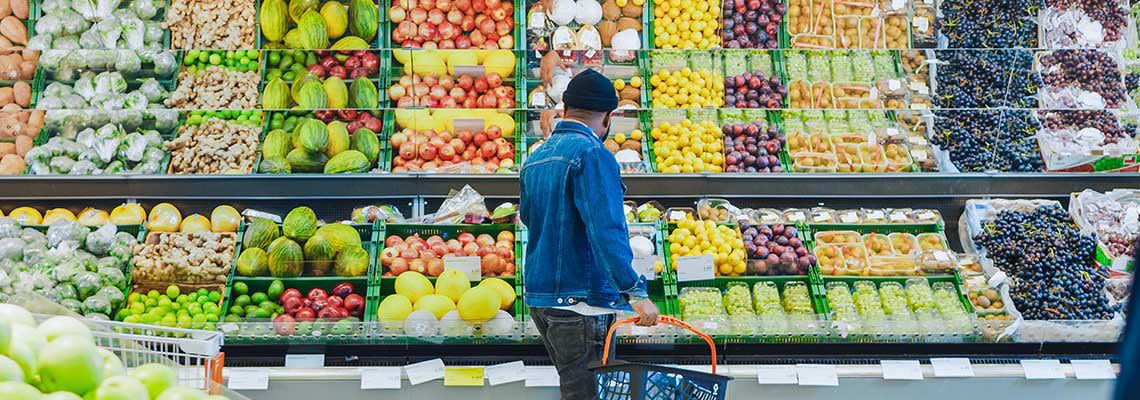 A man shops at a grocery store