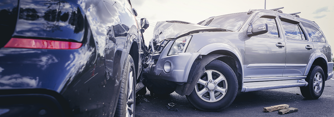 Grey and black SUV's in a collision