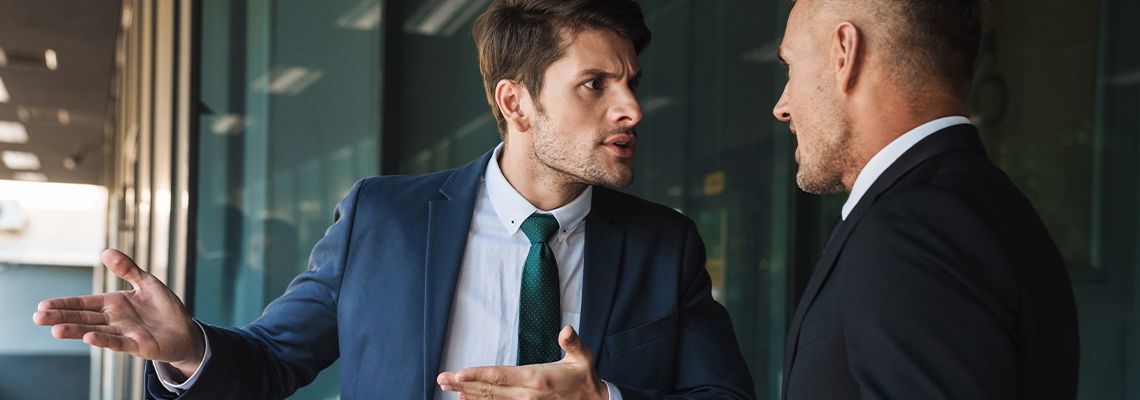 Business Partners arguing outside office