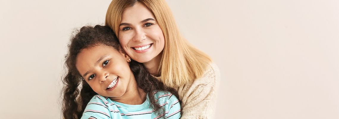 Women sharing happy moment with her adopted daughter