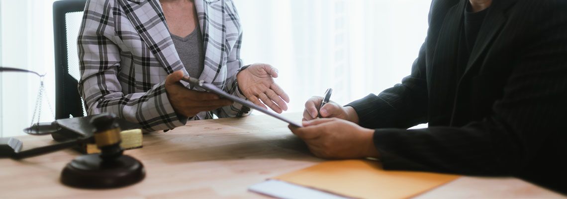 Businessman taking legal advice from lawyer
