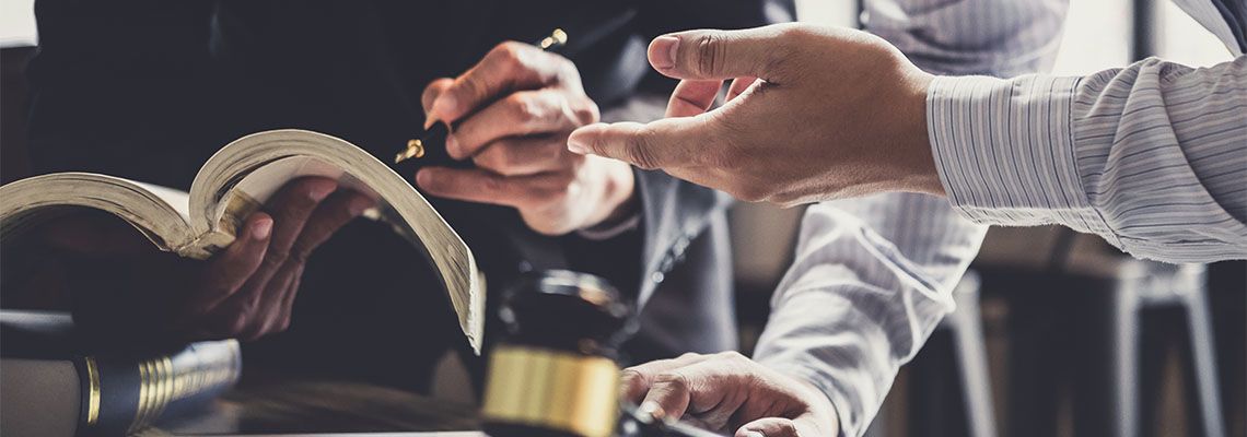 Businessman consulting with attorney