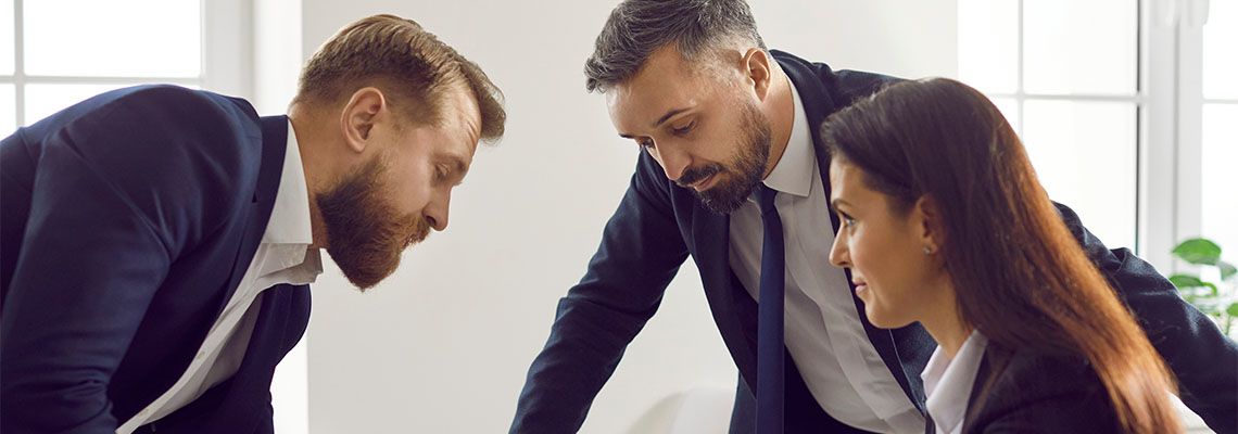 Businessmen counseling with attorney