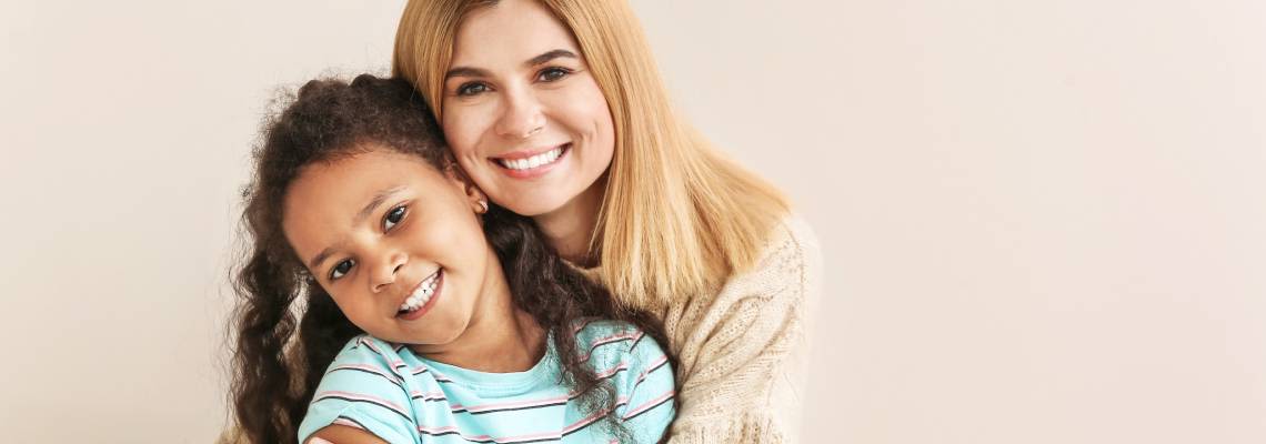 Happy women with adopted child