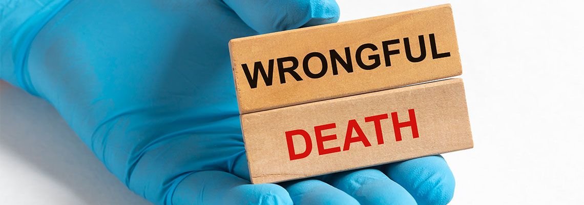 Wrongful Death concept inscription in doctor hand