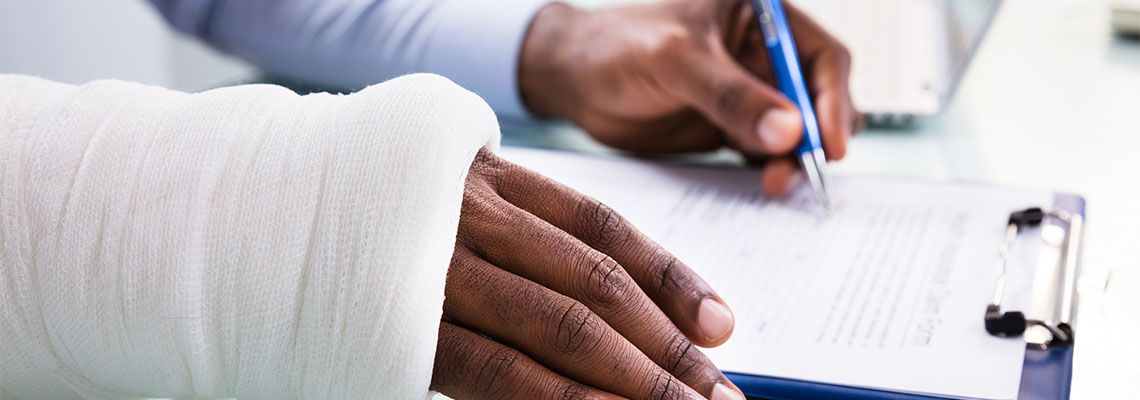 Injured worker filing compensation claim form