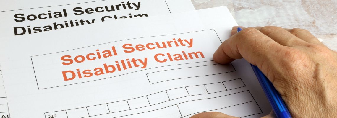 Man filling Social Security Disability claim form