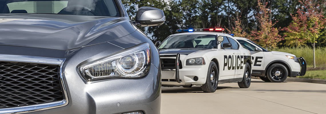 Police cars pulling over car