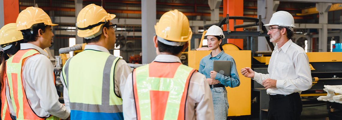 Management meeting and talking with factory workers
