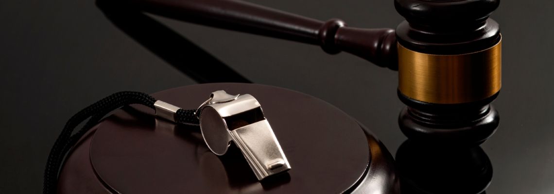 Whistle and gavel in table