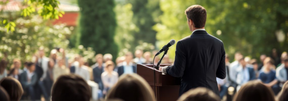 Man giving speech outdoors