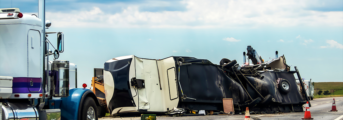 Fifth wheel RV overturned on highway with wench truck trying to get it off