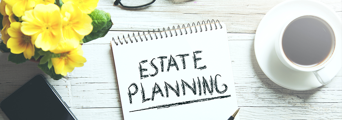 Estate Planning Text on Notepad next to a cup of coffee on a desk