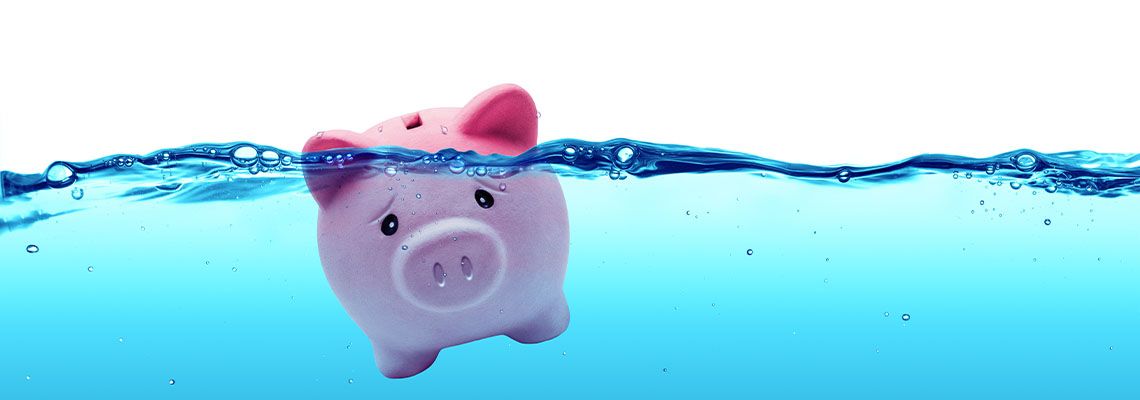 Drowning Piggy bank, concept of drowning in debt