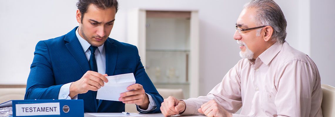 Young male lawyer visiting old man in testament concept