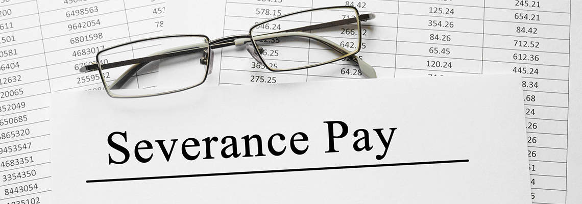 Paper with Severance Pay on a table