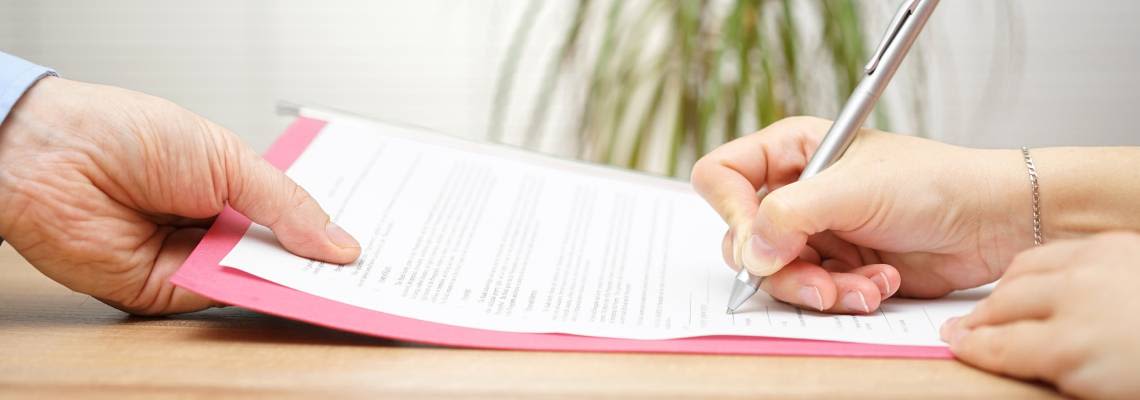 Women signs severance agreement