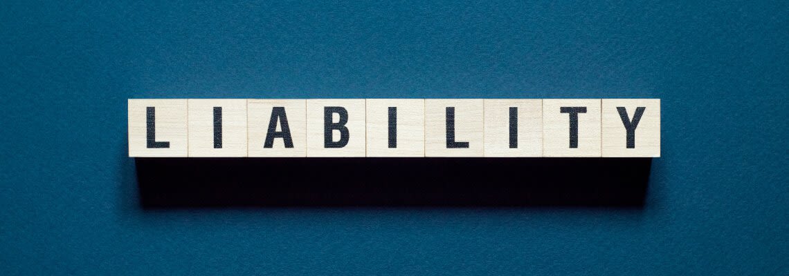 Letter blocks spelling out the word "LIABILITY"