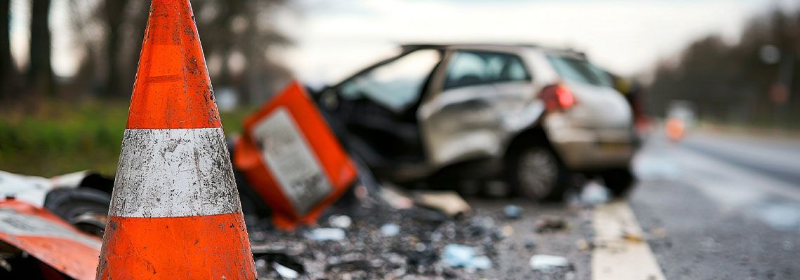 Crashed car in road construction zone