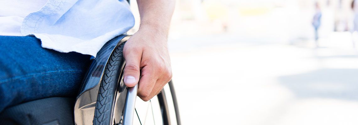 Cropped image of man using wheelchair