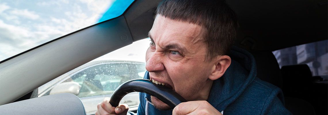Man bites steering wheel from anger while driving in traffic