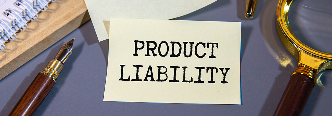 Product liability message written on white paper with blurry lake background