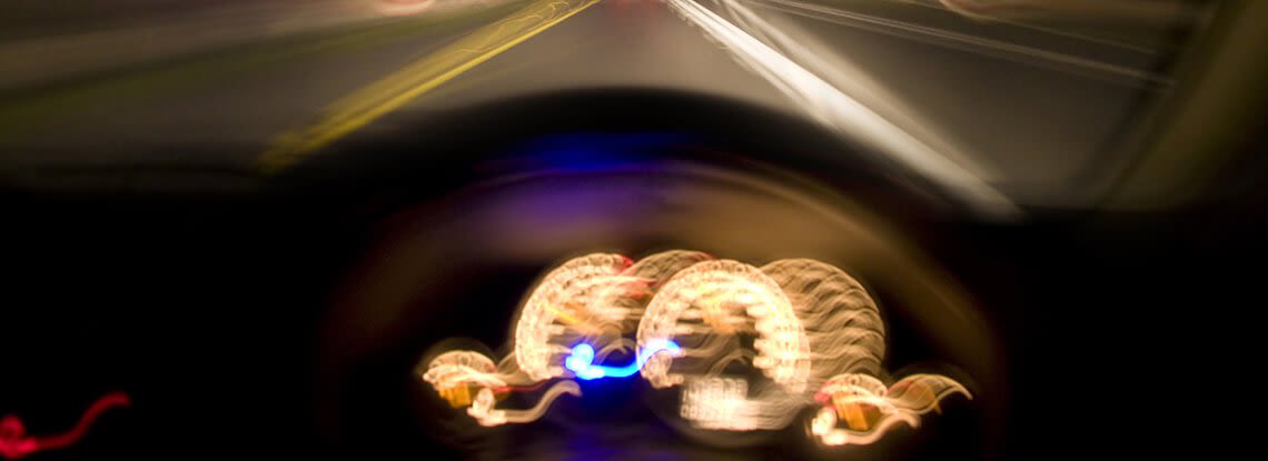 Blurry Image of Person Driving