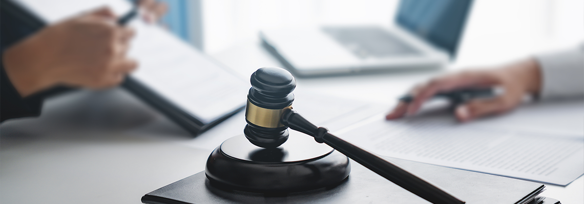 Lawyer with lawsuit meeting with client discussing with contract agreement