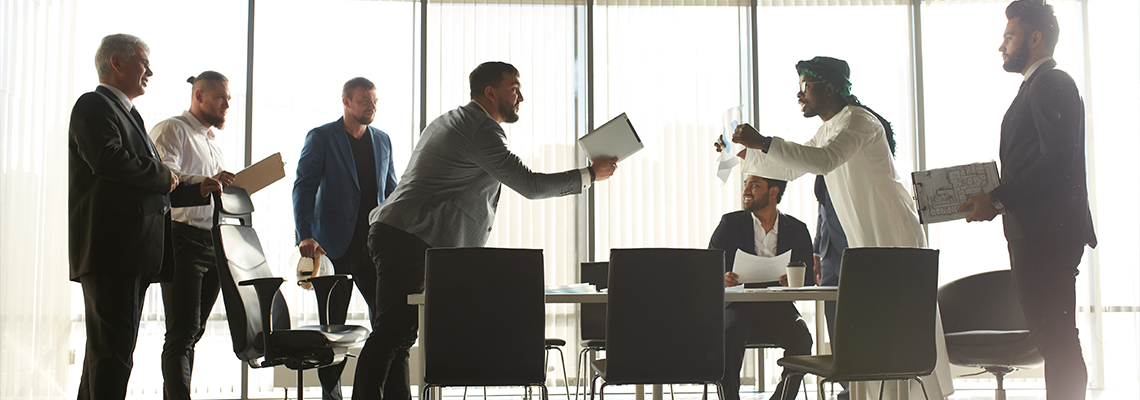 Mixed race business partners arguing about bad contract
