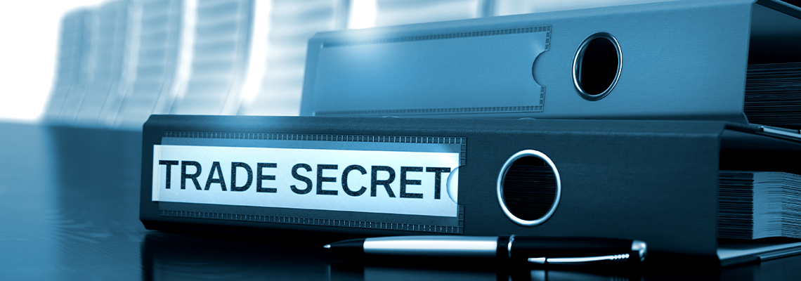 Folder with Inscription Trade Secret on Wooden Desktop