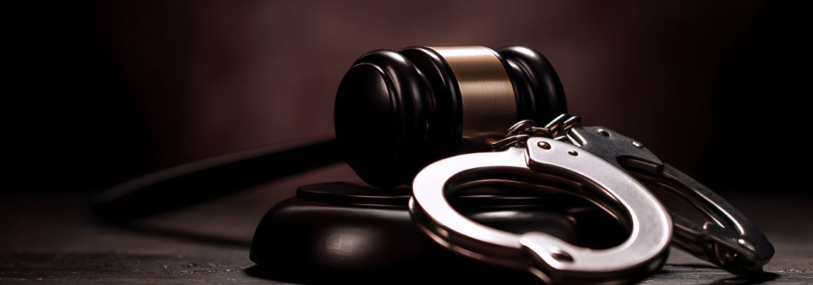 Gavel and handcuff on table