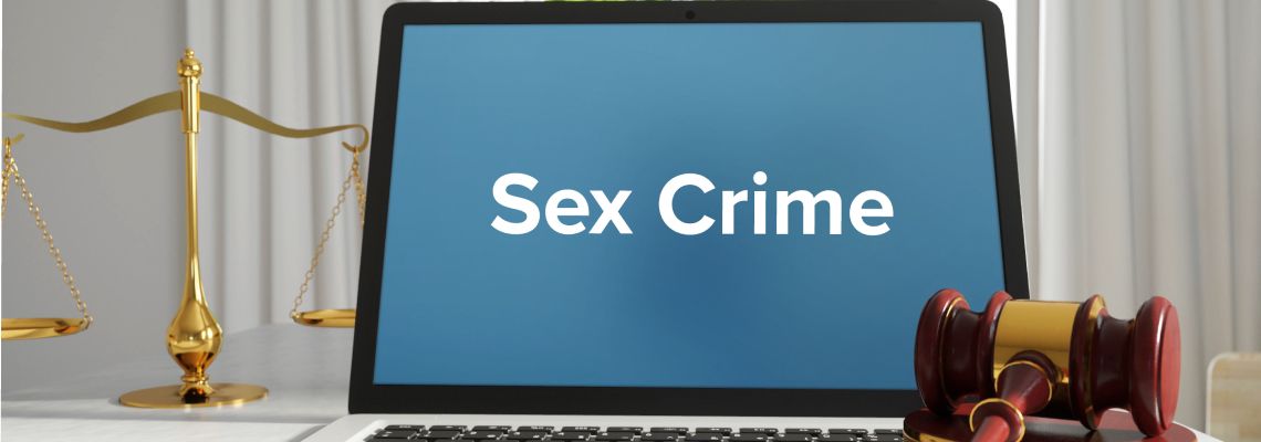 Sex crime word on laptop with gavel and scale of justice