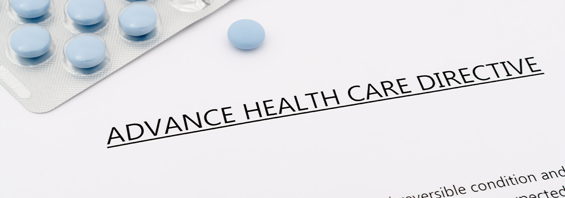 Advance health care directive with blue pills ans grey pen