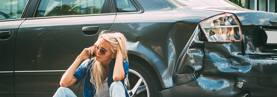 Girl on The Road, Near the Broken Car Calling on Her Phone