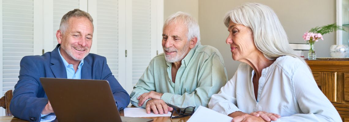 Senior couples consulting with attorney