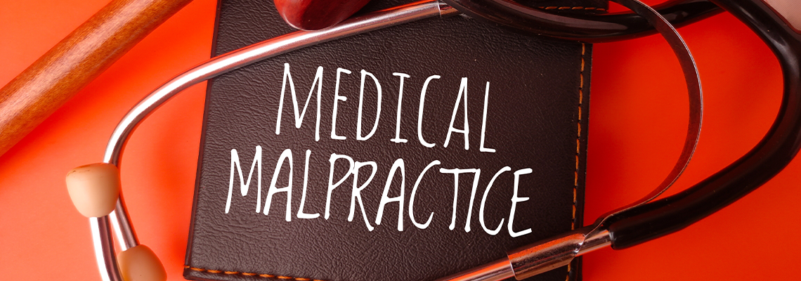 Conceptual representation of medical malpractice, involving a gavel and stethoscope