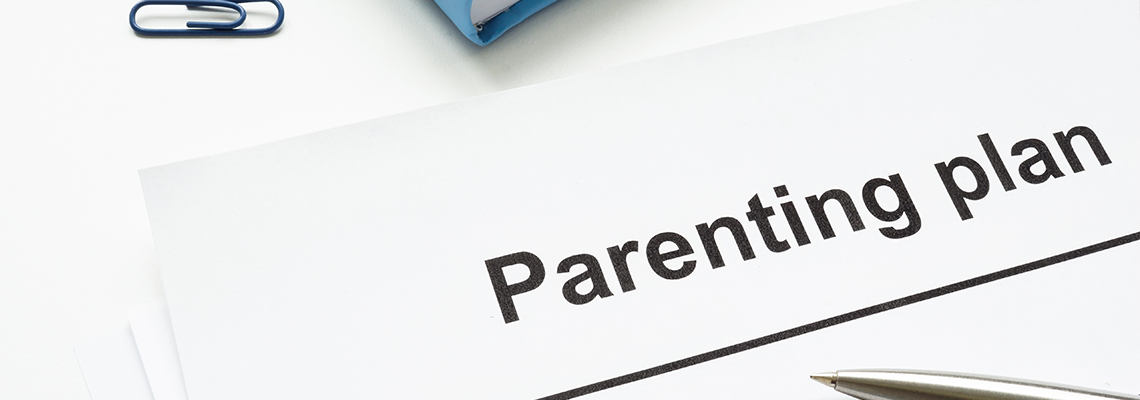 Parenting plan document and pen for signature