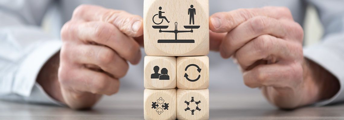 Wooden blocks with various icons representing equality