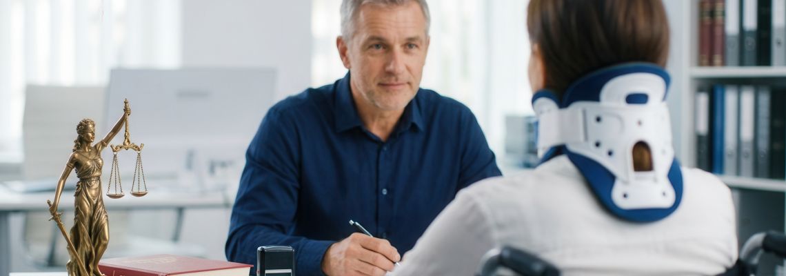 Injured women consulting with attorney