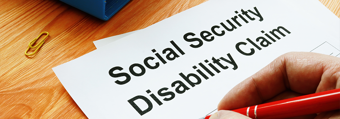 Man filling in Social Security Disability Claim