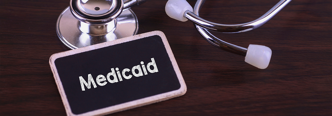 Medicaid words written on label tag with Stethoscope