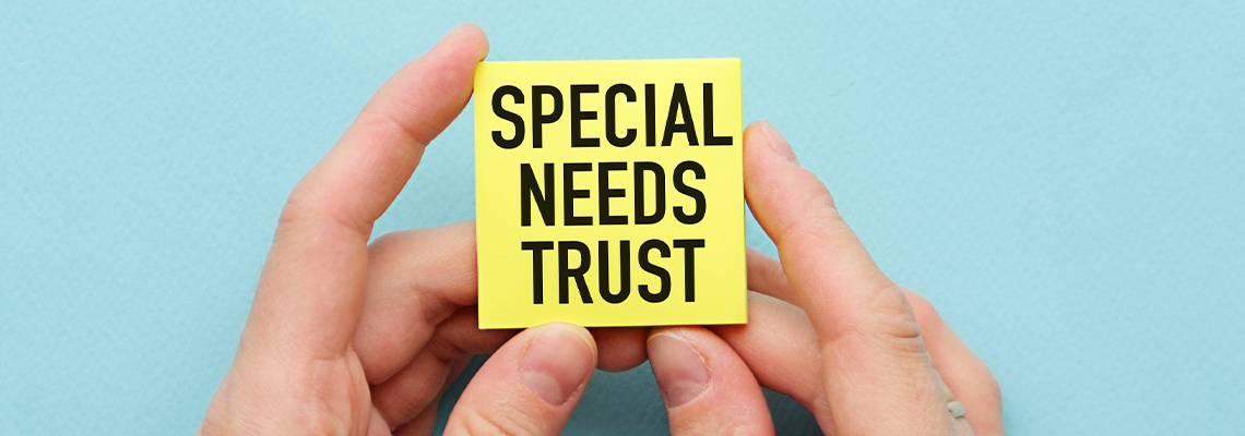 Businessman holding a card with SPECIAL NEEDS PLAN message