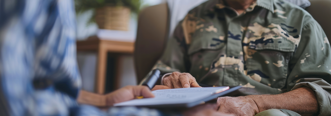 A veteran receiving assistance with Social Security benefits at a VA office